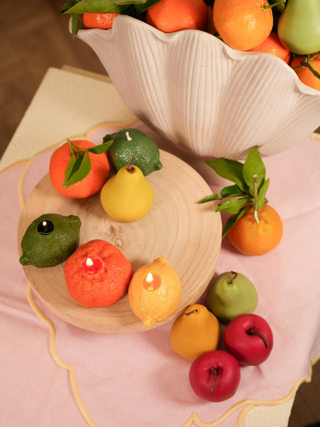 Handmade fruit-shaped candles in soy wax. One-of-a-kind textures, warm glow, and timeless shelf appeal for aesthetic spaces.